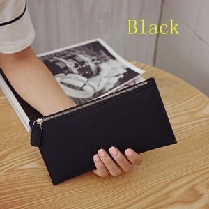 Woman’s faux leather zip wallet.